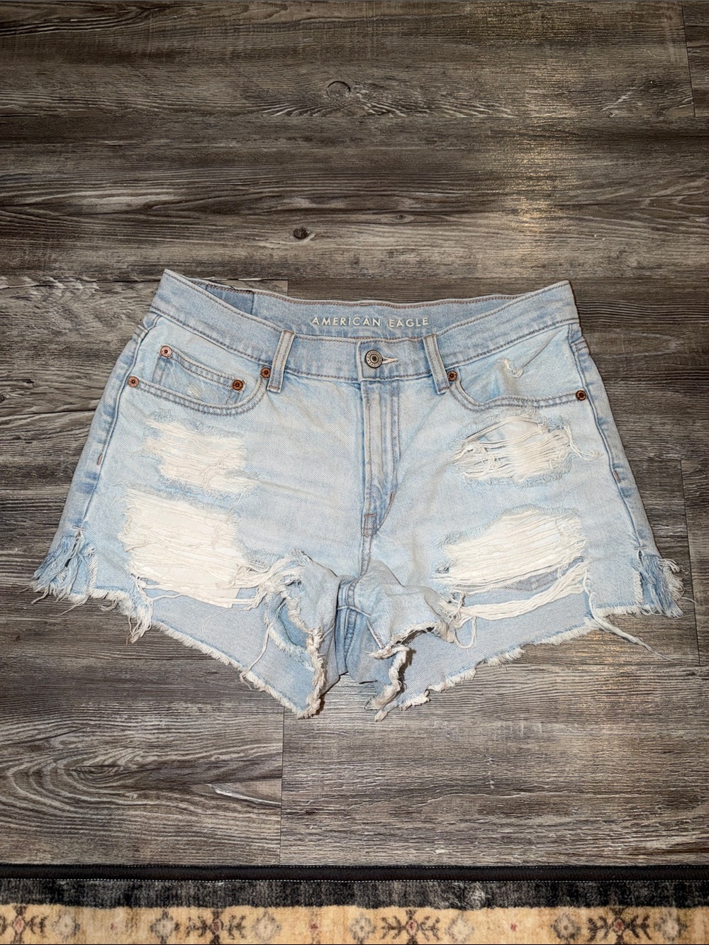 American Eagle Outfitters light wash distressed denim shorts